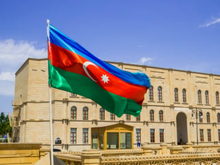 Azerbaijani flag in front of Baku's Heydar Mosque