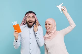 Arab couple holding passports airplane