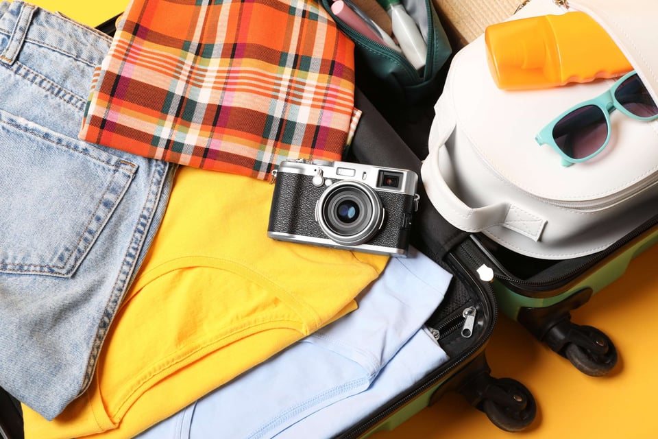 Packaged Suitcase Filled With Essentials For A Trip